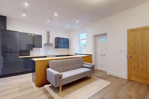 Bright and modern kitchen area featuring sleek ...