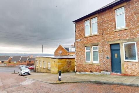 View of a classic red brick semi-detached house...