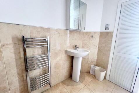Bright and modern bathroom featuring a clean pe...