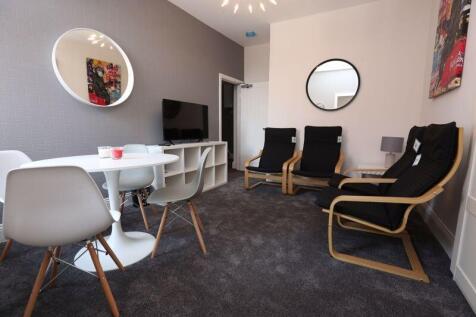 A cozy and modern living room featuring comfort...
