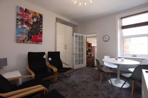 A cozy and inviting living room featuring moder...