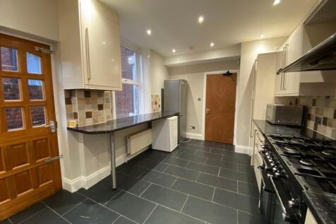 Bright and modern kitchen featuring sleek black...