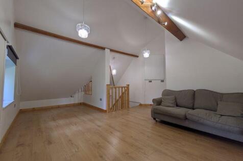 Spacious and contemporary living room featuring...