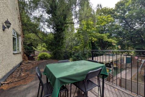 A peaceful garden terrace with outdoor seating ...
