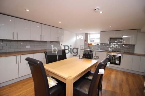 Modern kitchen with ample cabinetry, a central ...