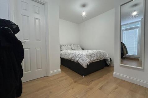 A bright and tidy double bedroom with a comfort...