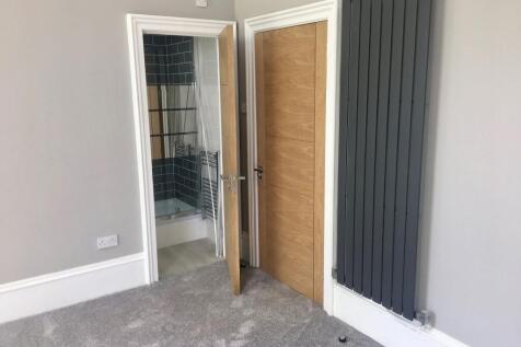 Bright and clean double bedroom featuring moder...