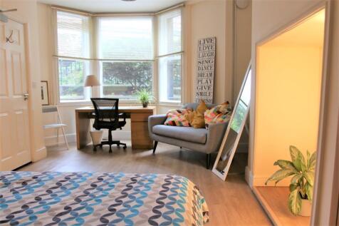 Bright and spacious master bedroom featuring a ...