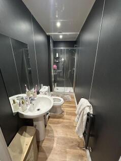 Modern bathroom featuring a clear glass shower ...