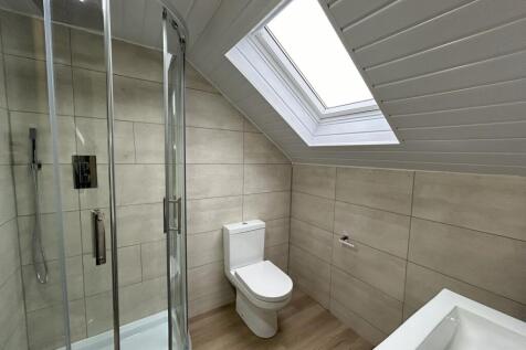 Modern bathroom with a spacious shower enclosur...