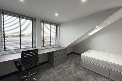 Bright and modern single bedroom featuring a sp...