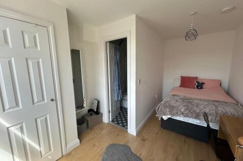 Bright and cozy double bedroom featuring a comf...