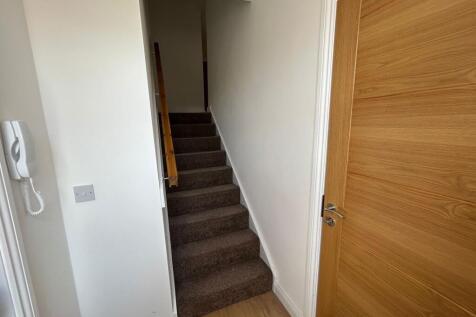 A clean and well-maintained hallway featuring n...