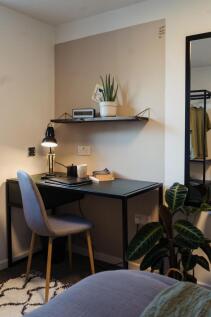 A cozy and neatly arranged study corner featuri...