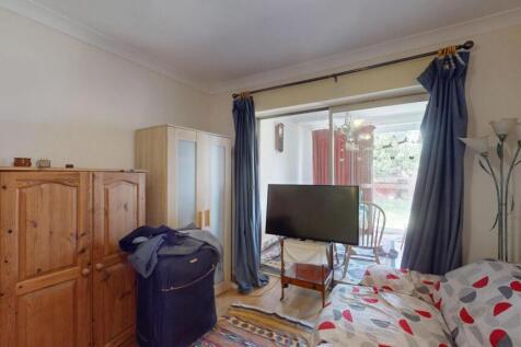 Bright and cozy double bedroom featuring a comf...