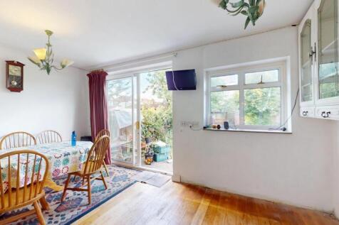 Bright and airy living room with ample natural ...