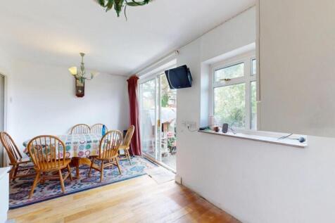 Bright and inviting living area featuring a woo...