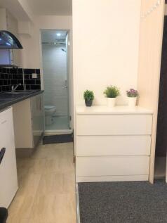 Bright and tidy kitchen space featuring modern ...