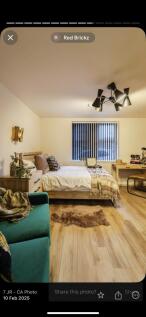 A warm and inviting master bedroom featuring a ...