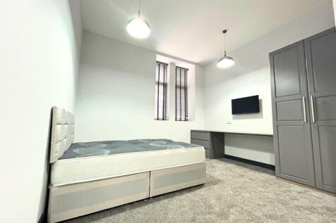 A modern double bedroom featuring a comfortable...