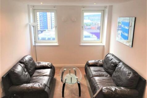 Bright and inviting living room featuring two c...