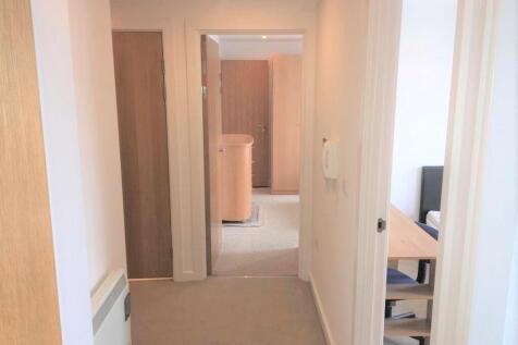 Bright and clean hallway with soft neutral tone...