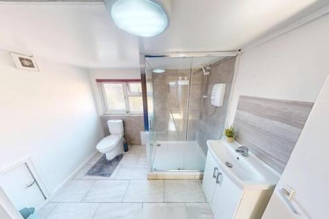 Bright and modern bathroom featuring a spacious...