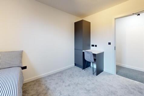A bright and spacious double bedroom featuring ...