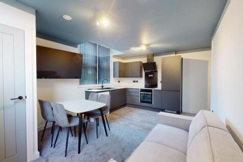 A modern and inviting kitchenette with sleek ap...