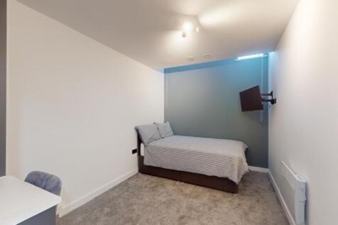 A bright and inviting double bedroom with moder...