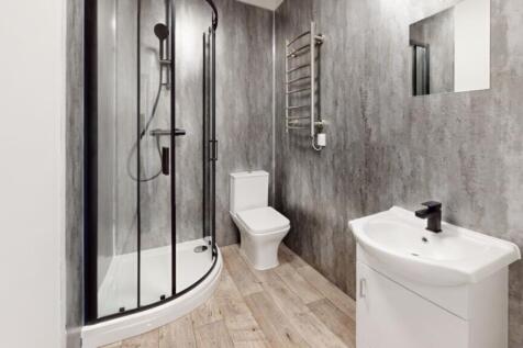 A modern and stylish bathroom featuring a sleek...