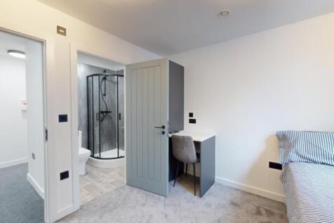 A bright and spacious double bedroom featuring ...