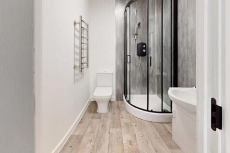 A modern and clean bathroom featuring a stylish...