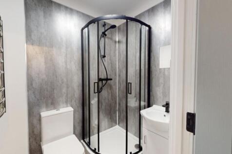 A modern and clean bathroom featuring a stylish...