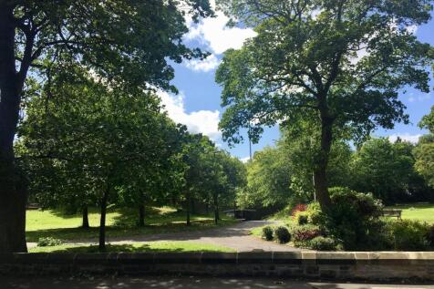 A beautifully maintained garden area with lush ...