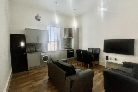 A modern living room featuring a compact but fu...