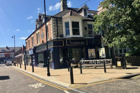 A charming corner pub with traditional brick an...