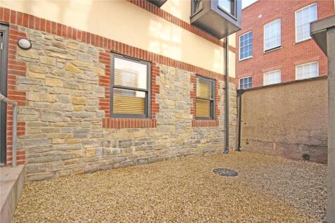 A tidy and private outdoor garden area with a s...