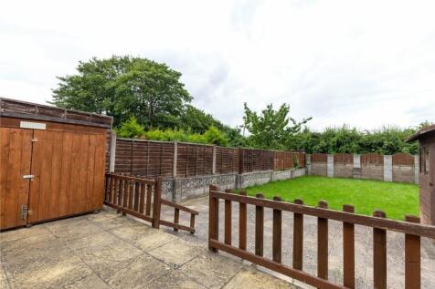 A spacious and well-maintained garden area feat...