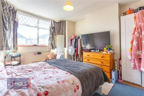 Bright and cozy double bedroom featuring a comf...