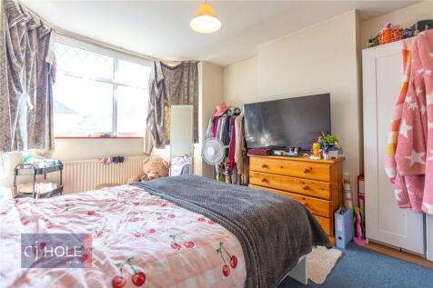 Bright and cozy double bedroom featuring a larg...