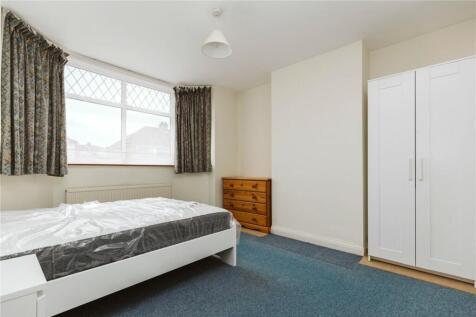 Bright and tidy double bedroom featuring a larg...