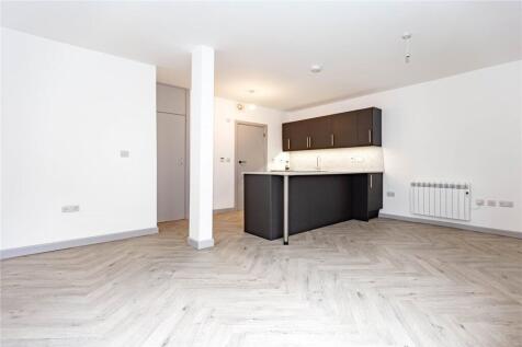 A spacious and modern open-plan living area wit...