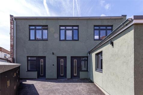 Modern terraced property with clean façade and ...