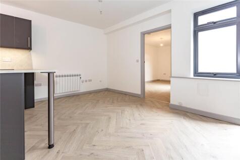 Bright and modern living room with stylish herr...