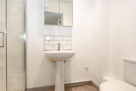 A clean and modern bathroom featuring a pedesta...