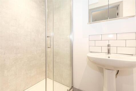 A clean and modern bathroom featuring a sleek g...
