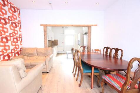 A bright and inviting living room featuring com...