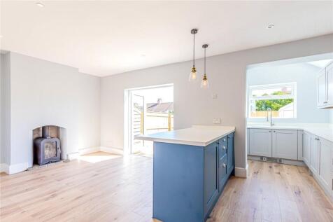 Bright and airy contemporary living room with l...