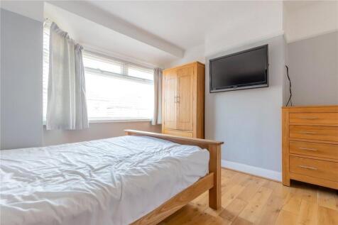 Bright and cozy double bedroom featuring a larg...
